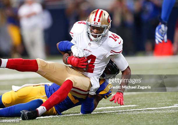 Jerome Simpson of the San Francisco 49ers gets tackled after making a reception during the game against the St. Louis Rams at the Edward Jones Dome...