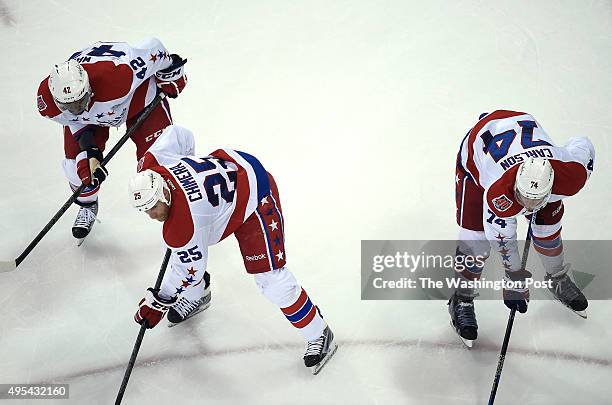 Washington Capitals right wing Joel Ward , Washington Capitals left wing Jason Chimera , and Washington Capitals defenseman John Carlson get set for...