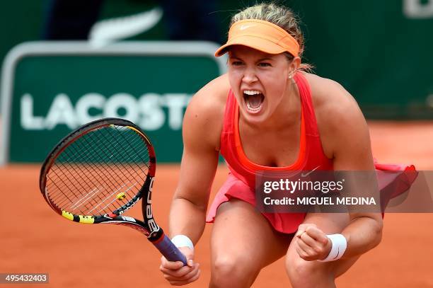 Canada's Eugenie Bouchard celebrates after winning her French tennis Open round quarter final match against Spain's Carla Suarez Navarro at the...