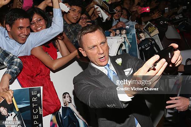 Actor Daniel Craig signs autographs and takes selfies with fans during the "Spectre" Mexico City premiere at Auditorio Nacional on November 2, 2015...