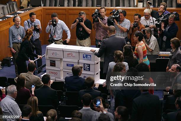 Two million boxed petitions are wheeled into a hearing room in the Hart Senate Office Building before a Senate Judiciary Committee hearing about...