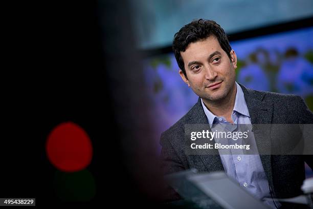 Jonathan Oringer, chief executive officer of Shutterstock Inc., listens to a question during a Bloomberg Television interview in New York, U.S., on...