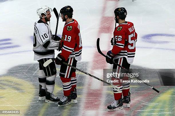 Mike Richards of the Los Angeles Kings shakes hands with Jonathan Toews of the Chicago Blackhawks after Game Seven of the Western Conference Final in...