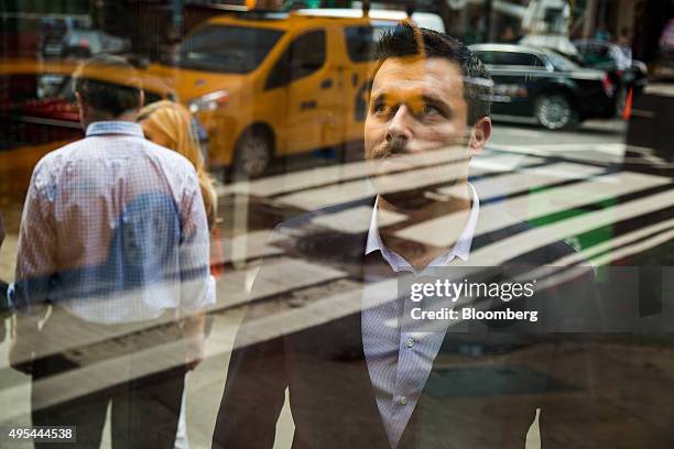 Zach Coopersmith, partner at Leading Ridge Capital Partners LLC, poses for a photograph in Times Square in New York, U.S., on Tuesday, September 1,...