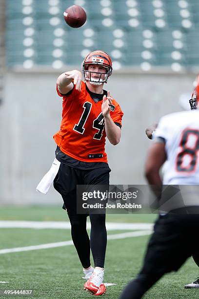 Andy Dalton of the Cincinnati Bengals throws a pass during an organized team activity workout at Paul Brown Stadium on June 3, 2014 in Cincinnati,...