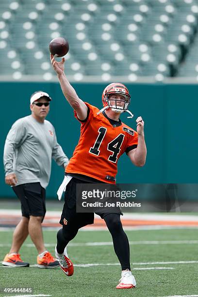 Andy Dalton of the Cincinnati Bengals throws a pass during an organized team activity workout at Paul Brown Stadium on June 3, 2014 in Cincinnati,...