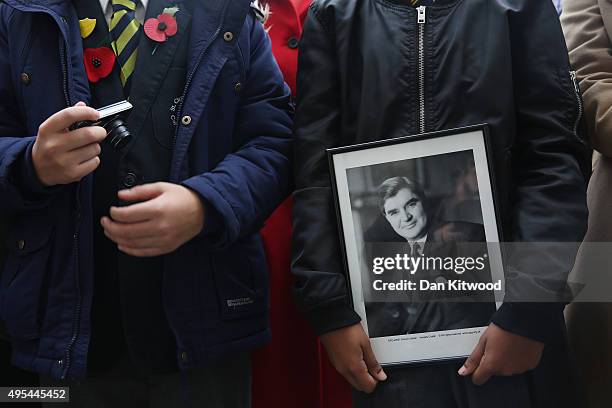 Two pupils from St Clement Danes Schools, Omar ait el Caid and Amina Douglas watch the former leader of the Labour Party Neil Kinnock unveil an...