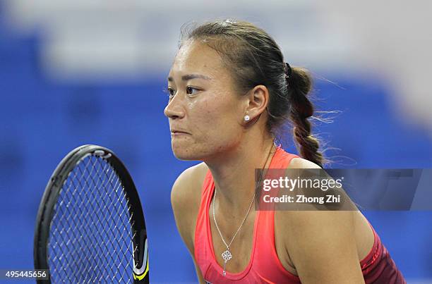 Shilin Xu of China looks on with Xiaodi You of China during the their doubles match against Anabel Medina Garrigues of Spain and Arantxa Parra...