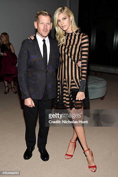 Designer and previous winner Paul Andrew and model Devon Windsor attend the 12th annual CFDA/Vogue Fashion Fund Awards at Spring Studios on November...