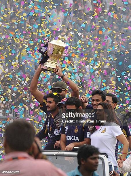 Owner Juhi Chawla with Piyush Chawla and other players carrying the champions trophy during felicitation ceremony of the IPL champions Kolkata Knight...