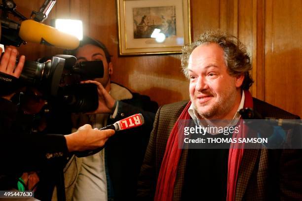 French author Mathias Enard answers journalists' questions at the Drouant restaurant in Paris after he was awarded with France's top literary prize,...