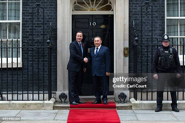 Britain's Prime Minister David Cameron greets the President of Kazakstan, Nursultan Nazarbayev, at Downing Street on November 3, 2015 in London,...