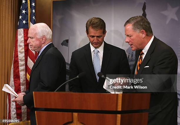 Senators John McCain , Jeff Flake and Richard Burr participate in a news conference about veterans affairs on Capitol Hill, June 3, 2014 in...