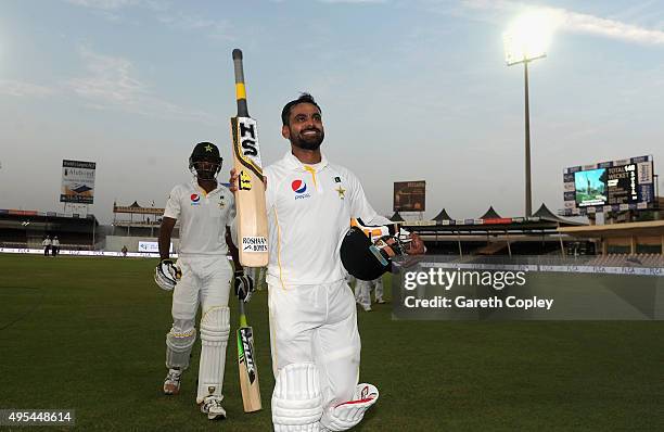 Mohammad Hafeez of Pakistan salutes the dressing room as he leaves the field at stumps on day three of the 3rd Test between Pakistan and England at...