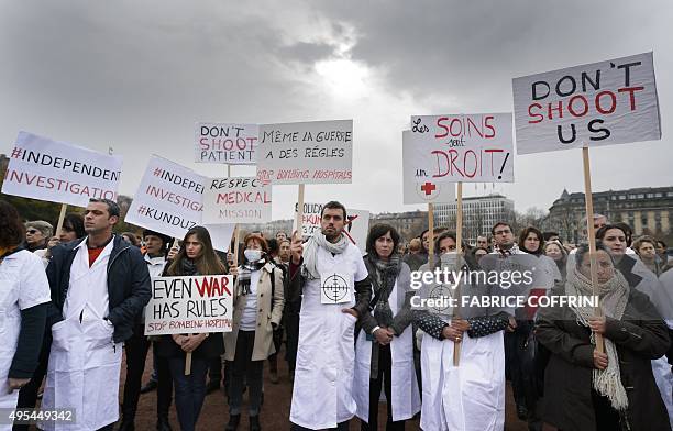 Members of Doctors Without Borders, also known by its French name Medecins Sans Frontieres hold placards during a demonstration on November 3, 2015...