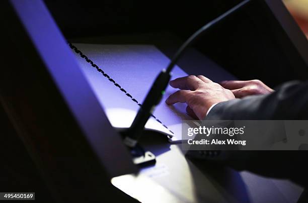 Chen Guangcheng, blind Chinese lawyer, human rights activist and senior fellow in human rights at the Witherspoon Institute, reads a Braille speech...