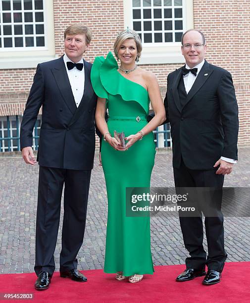 King Willem-Alexander of The Netherlands, Queen Maxima of The Netherlands and Prince Albert II of Monaco arrive at the Loo Palace for dinner on June...