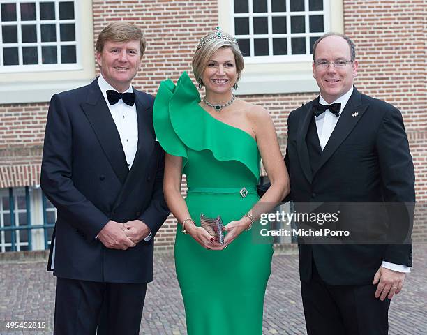 King Willem-Alexander of The Netherlands, Queen Maxima of The Netherlands and Prince Albert II of Monaco arrive at the Loo Palace for dinner on June...