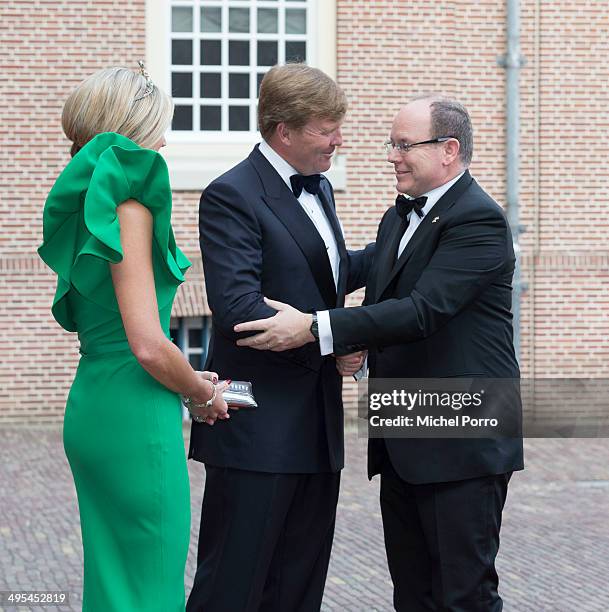 King Willem-Alexander of The Netherlands, Queen Maxima of The Netherlands and Prince Albert II of Monaco arrive at the Loo Palace for dinner on June...