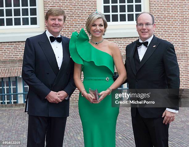 King Willem-Alexander of The Netherlands, Queen Maxima of The Netherlands and Prince Albert II of Monaco arrive for dinner at the Loo Royal Palace on...