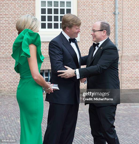 King Willem-Alexander of The Netherlands, Queen Maxima of The Netherlands and Prince Albert II of Monaco arrive for dinner at the Loo Royal Palace on...