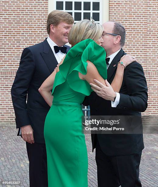 King Willem-Alexander of The Netherlands, Queen Maxima of The Netherlands and Prince Albert II of Monaco arrive for dinner at the Loo Royal Palace on...