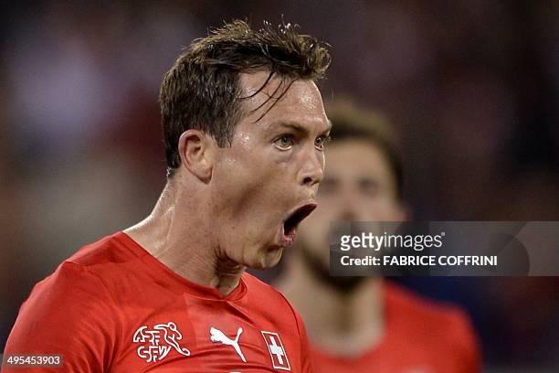 Switzerland's defender Stephan Lichtsteiner reacts after scoring during a friendly football match between Switzerland and Peru on June 3 in Lucerne,...