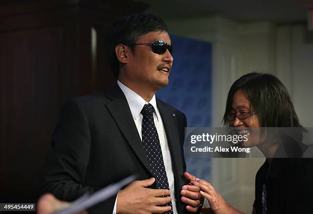 With the help of his wife Yuan Weijing , blind Chinese lawyer and human rights activist and senior fellow in human rights at the Witherspoon...