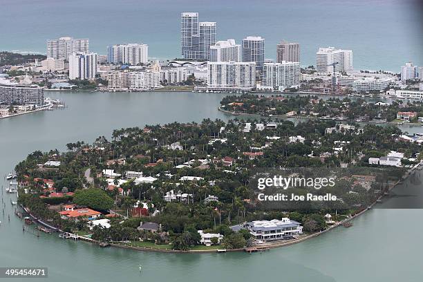 Single family homes on islands and condo buildings on ocean front property are seen in the city of Miami Beach June 3, 2014 in Miami, Florida....