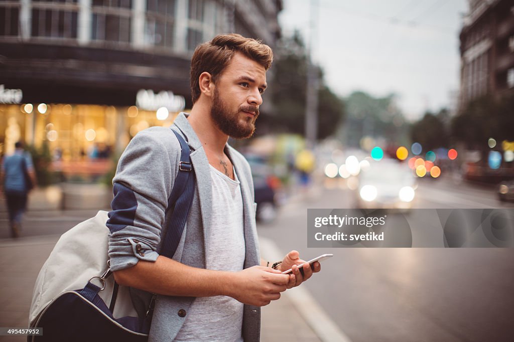 Young man on the streets of big city.