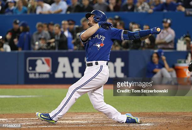 Josh Donaldson of the Toronto Blue Jays hits a two-run home run in the third inning against the Kansas City Royals during game three of the American...