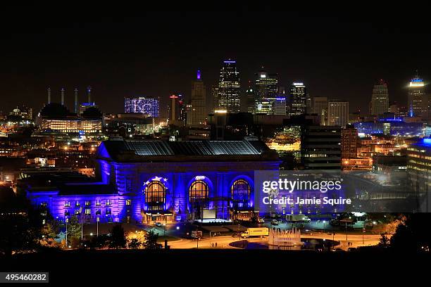 Union Station is lit up with blue lights in front of the Kansas City skyline ahead of a parade and celebration in honor of the Kansas City Royals'...