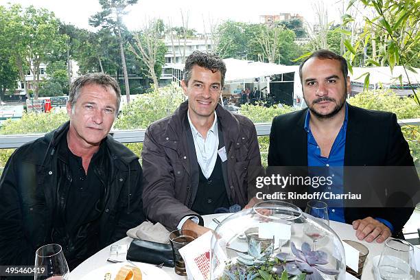 Actor Bruno Wolkowitch, guest and humorist Francois Xavier Demaison pose at France Television french chanels studio whyle the Roland Garros French...