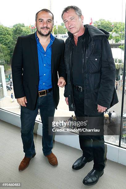 Actor Bruno Wolkowitch and humorist Francois Xavier Demaison pose at France Television french chanels studio whyle the Roland Garros French Tennis...