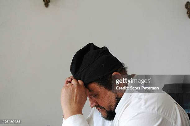 Dawud Salahuddin, an African-American convert to Islam who was born David Theodore Belfield , adjust his hat while posing for a portrait on March 16...