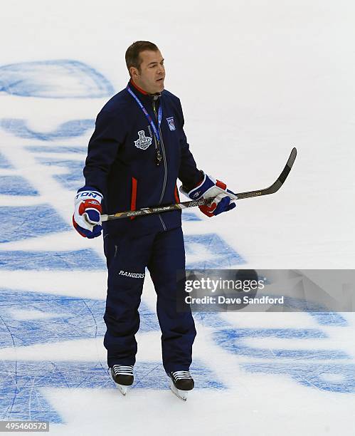 Head Coach Alain Vigneault of the New York Rangers gives direction during a practice session ahead of Media Day for the 2014 Stanley Cup Final at...