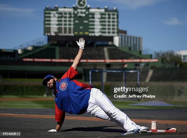 Jake Arrieta of the Chicago Cubs stretches before their game against the New York Mets on June 3, 2014 in Chicago, Illinois.