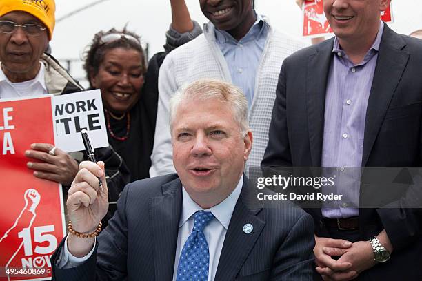 Seattle Mayor Ed Murray pauses while signing a bill that raises the city's minimum wage to $15 an hour on June 3, 2014 in Seattle, Washington. The...