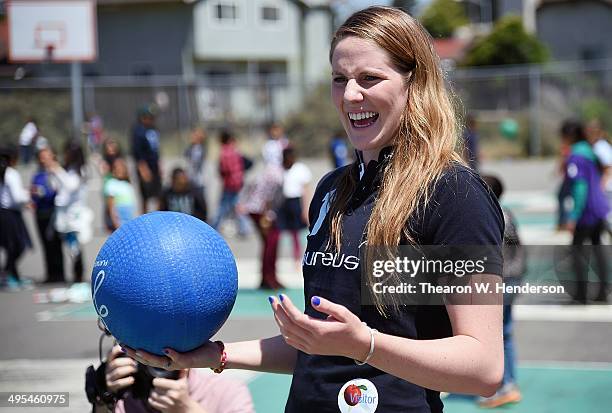 Winner of the Laureus World Sports Award for a female athlete and four-time Olympic gold medalist Missy Franklin plays fourquare with studends at...