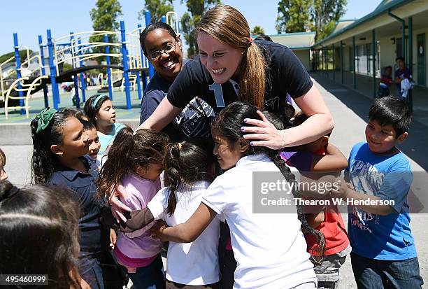 Winner of the Laureus World Sports Award for a female athlete and four-time Olympic gold medalist Missy Franklin hugs several studends at Bayview...