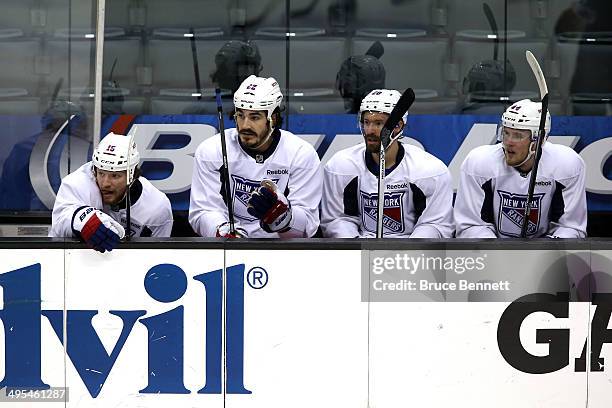 Derek Dorsett, Brian Boyle, Dominic Moore and Justin Falk of the New York Rangers look on during a practice session ahead of the 2014 NHL Stanley Cup...