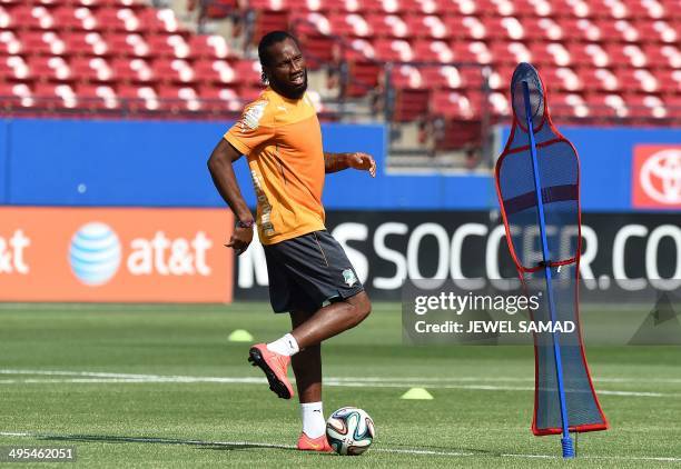 Ivory Coast's forward Didier Drogba dribbles the ball during a training session at the Toyota Stadium in Frisco, Texas, on June 3 on the eve of their...