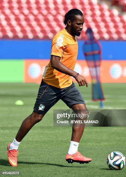 Ivory Coast's forward Didier Drogba dribbles the ball during a training session at the Toyota Stadium in Frisco, Texas, on June 3 on the eve of their...