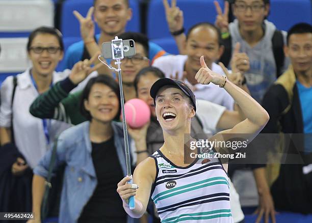 Elina Svitolina of Ukraine takes selfie with fans after winning the match against Andrea Petkovic of Germany on day 2 of Huajin Securities WTA Elite...