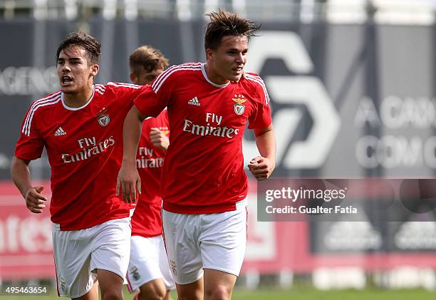 Benfica's forward Oliver Sarkic celebrates with teammate Yuri Ribeiro after scoring a goal during the UEFA Youth League match between SL Benfica and...