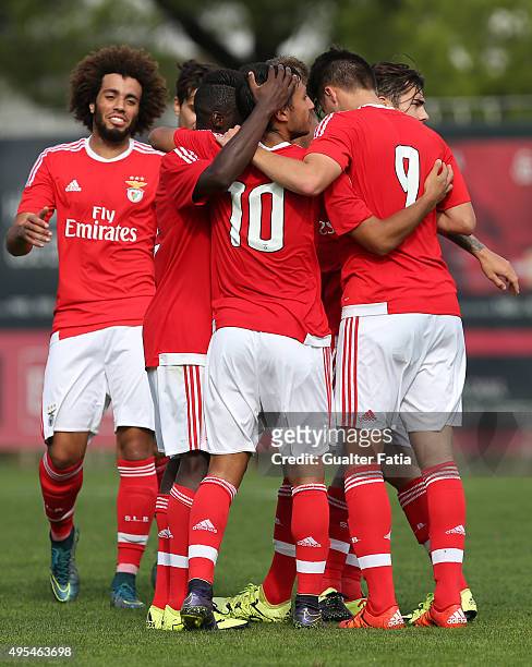 Benfica's forward Joao Carvalho celebrates with teammates after scoring a goal during the UEFA Youth League match between SL Benfica and Galatasaray...