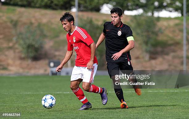 Benfica's forward Joao Carvalho with Galatasaray ASÕ midfielder Bugra Yetkin in action during the UEFA Youth League match between SL Benfica and...