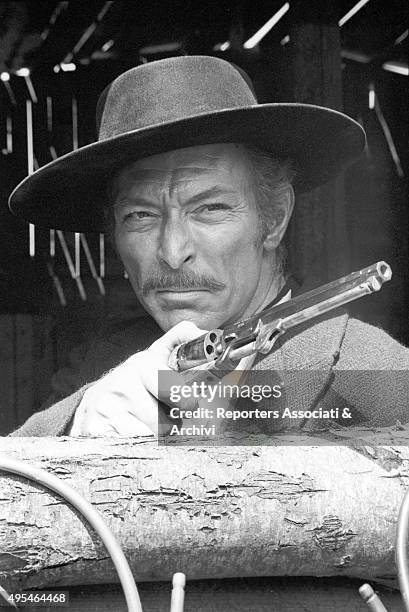 American actor Lee Van Cleef holding a gun in the film The Good, the Bad and the Ugly. 1966