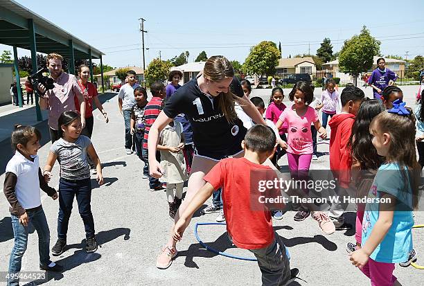 Winner of the Laureus World Sports Award for a female athlete and four-time Olympic gold medalist Missy Franklin plays hula hoop tag with studends at...