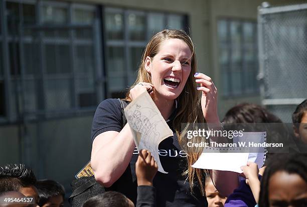 Winner of the Laureus World Sports Award for a female athlete and four-time Olympic gold medalist Missy Franklin is surrounded by students seeking...